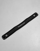 Black weight belt with 'Training Club' text on a gray background